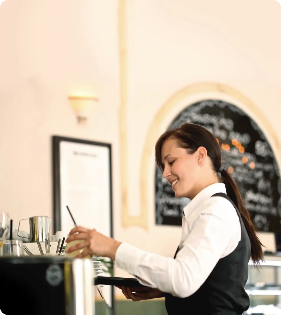 Waitress making a drink.