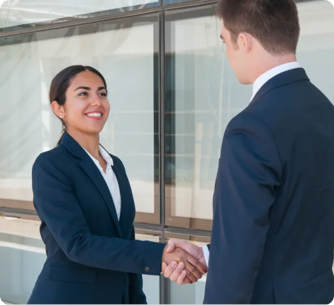 Woman and a man shaking hands.