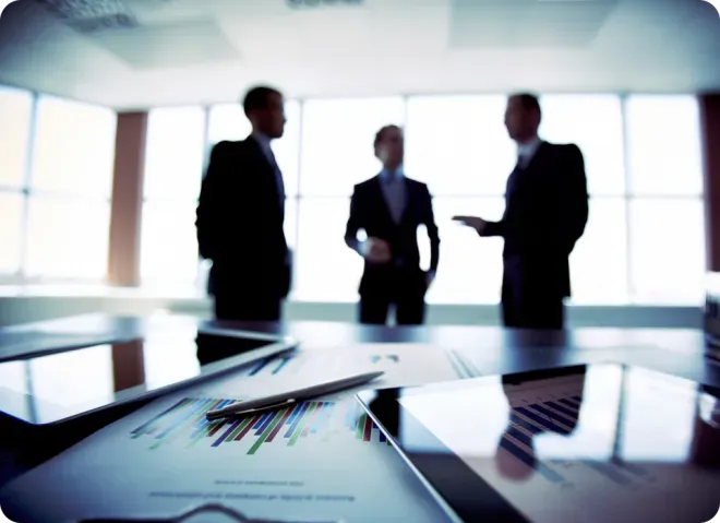 Three men conversing.