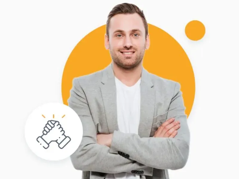 A man in a grey suit in front of an orange circle.