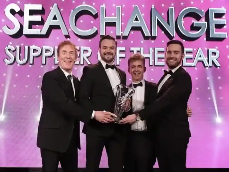 SeaChange employees accepting an award.