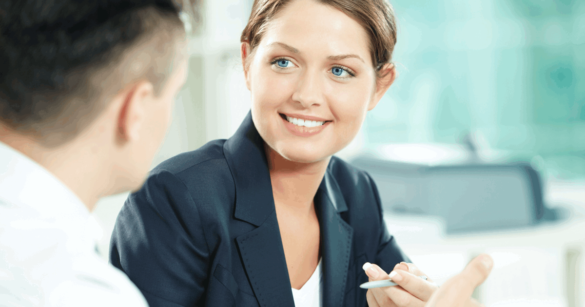 An insurance broker speaks with a client