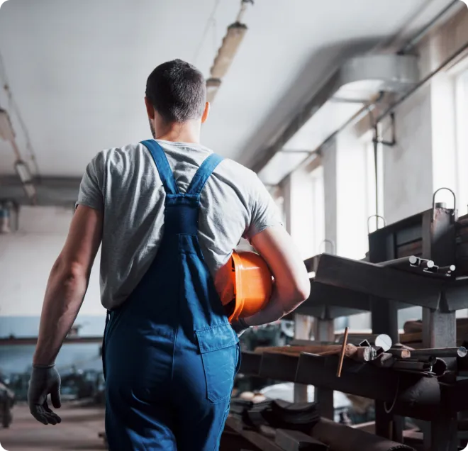 Man walking with orange PPE.