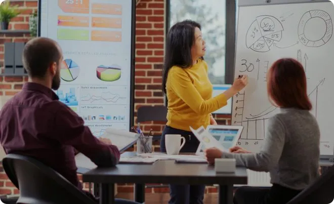 A professor teaching a finance class to adults.