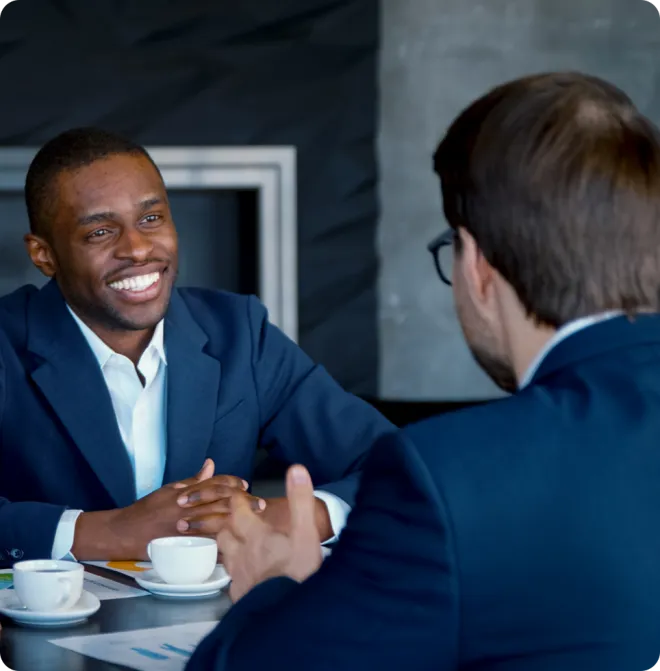 Two businessmen having coffee.