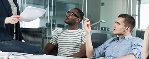 Two adults meeting with a consultant.