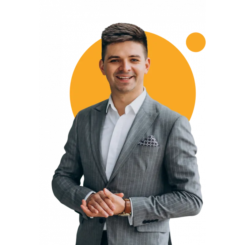 Man in grey suit holding his hands.