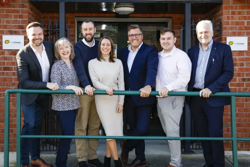 SeaChange employees posing outside of the office.