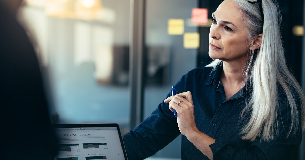 Older business woman listening during a meeting