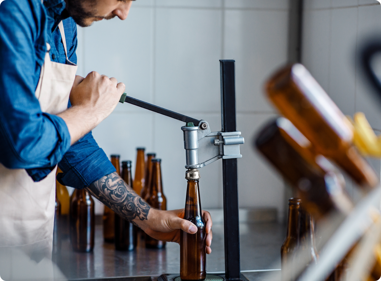 A brewer bottling beer.
