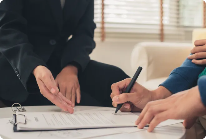 Man signing a document.