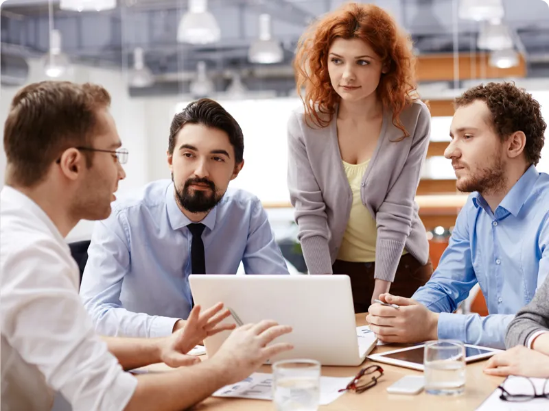 Young professional confer at a table