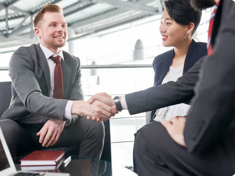 Business people shaking hands after meeting.